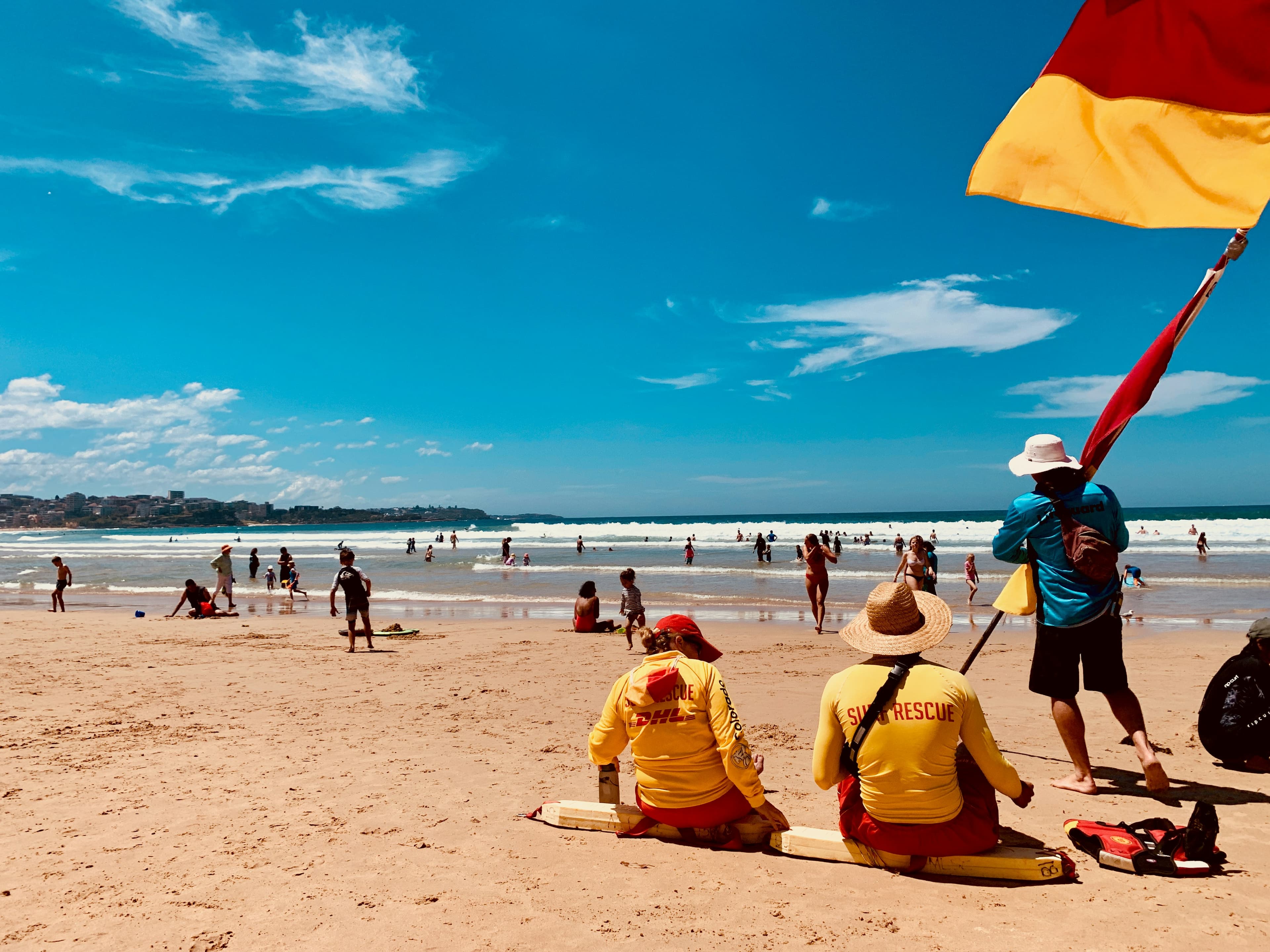 Lifeguards sitting on the beach